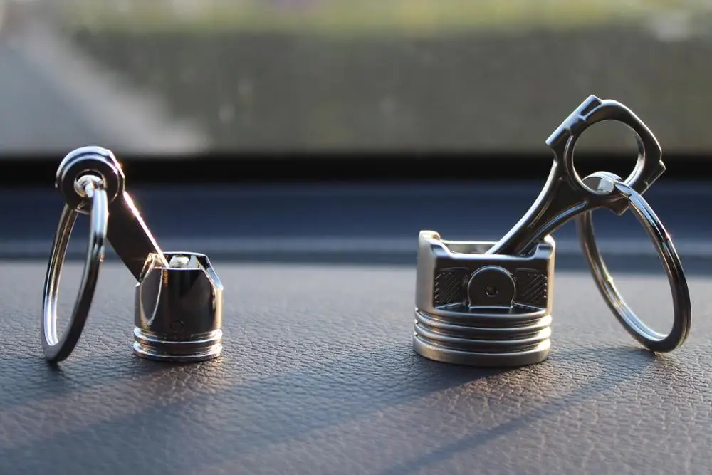 Auto dodatki Motor batni keychain Kovinska zapestnica pero za avto notranjo opremo