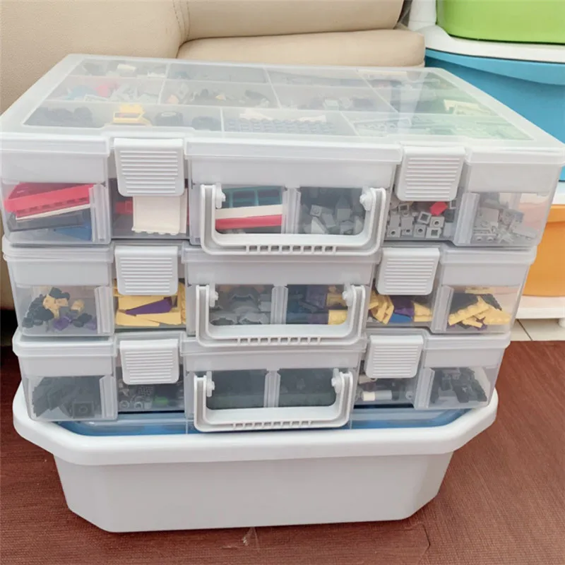 Ročno dobave izbor boxed igrače majhnih delcev deli mreža pregleden pakiranje skladiščenje in dodelavo polje